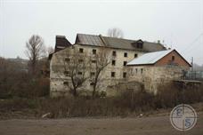 Dilapidated building on the river - likely Mill