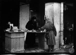 Austrian soldier buys goods in a Jewish store
