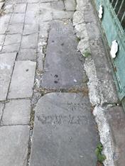 Tombstones from Old cemetery used in the pavement