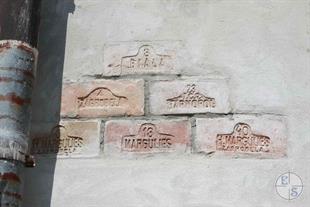 Brick with a stigma of the Jewish manufacturer Margulis, in the wall of the castle
