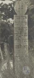 Women's wooden tombstone 1911 in Ozyutychi